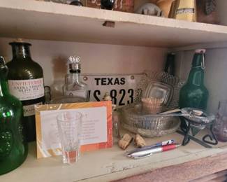 Misc. bottles and a license plate