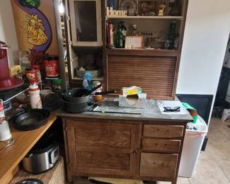 Hoosier Cabinet. Has doors but they need to be put back on. May be missing the hardware as shown but we might find them. Working flour sifter.