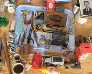 Various small collectibles including a cigar box, a camera, lighters, coin banks, mugs, bottles and jars, lighters, Half & Half tobacco & Prince Albert cans and more!
