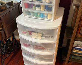 Thread in the top, sewing miscellaneous in the bottom