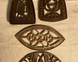 Old Cast Iron Trivets Incl. Advertising