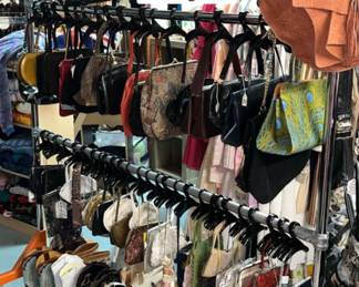 Lots of elegant purses and classic leather bags, including some designer names
