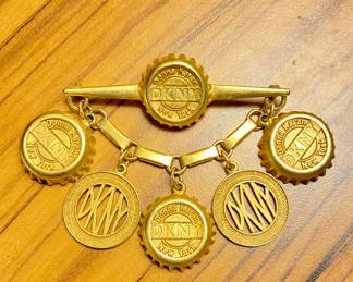 DKNY Bottle cap/coin/token brooch