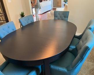 #36 $550.00 Black wood dining table IKEA with butterfly leaf extension 45x65 oval or 46 round with 6 chairs 35Hx22W