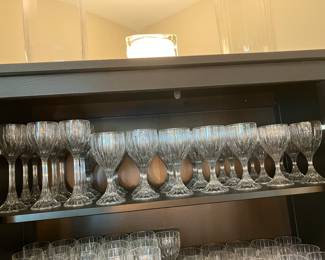 #131 - Mikasa Park Lane pattern - 189 pieces - BUY ALL for $1,500 -Hock wine (8), Red Wine (16), White wine (22), Ice water (19), Old fashion (16), Tumblers (7), Martini glasses (8), Digestive (8), Beer steins (8), Irish Coffee mugs (8), Champagne flutes (16), Sherbet Champagne (8), Bud vases (8), Coffee cups with handles (8), Candy dishes (4), Gravy bowl (2), Gravy bowl (2),Compote (8), Water pitcher, Candlesticks 2 tall / 4 smalls, Round veggie/slalad/fruit bowls (2), Trifle bowl (1), Champagne bucket (1) ice bucket (1), Decorative sea shell bowl (1)