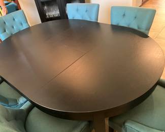 #36 $550.00 Black wood dining table IKEA with butterfly leaf extension 45x65 oval or 46 round with 6 chairs 35Hx22W