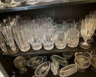 #131 - Mikasa Park Lane pattern - 189 pieces - BUY ALL for $1,500 -Hock wine (8), Red Wine (16), White wine (22), Ice water (19), Old fashion (16), Tumblers (7), Martini glasses (8), Digestive (8), Beer steins (8), Irish Coffee mugs (8), Champagne flutes (16), Sherbet Champagne (8), Bud vases (8), Coffee cups with handles (8), Candy dishes (4), Gravy bowl (2), Gravy bowl (2),Compote (8), Water pitcher, Candlesticks 2 tall / 4 smalls, Round veggie/slalad/fruit bowls (2), Trifle bowl (1), Champagne bucket (1) ice bucket (1), Decorative sea shell bowl (1)