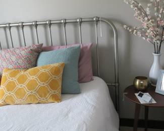 Silver metal headboard and footboard.