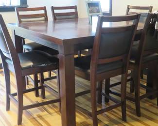 Bar height table and six chairs.