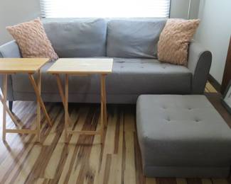 Grey upholstery couch and ottoman.