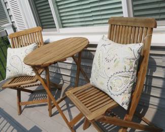Wood 3 piece patio set with pillows.