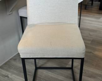 One of three counter height stools