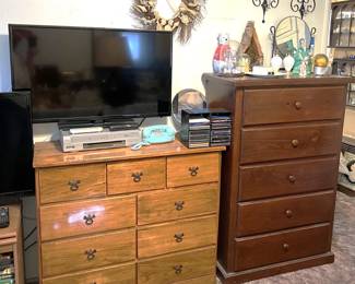 Here we have a TV monitor, a dual VCR/DVD player, and two dressers. A classic telephone, grass wreath, and more are here, too.