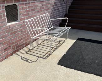 This, of course, is an outdoor bench frame in need of cushions.