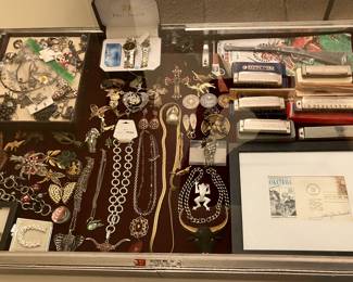 costume jewelry, harmonicas, etc.
