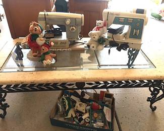 Annalee Dolls resting on a wonderful Cast Iron Glass Top Coffee Table