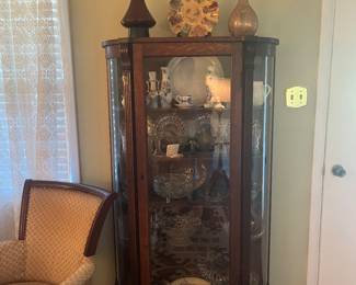 1930’s curved china cabinet. Contents sold separately.