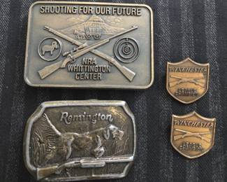 Gun related belt buckles and awards