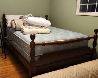 Full size bed with cannonball post frame, good condition!