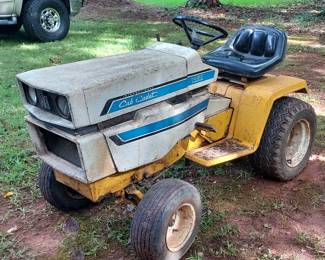 International Harvester Cub Cadet 1450 - Runs! Have several parts/ accessories that go with it!'