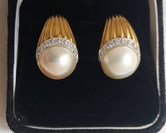 Italian Designer Piero Milano- 18K Yellow Gold Pearl and Diamond Clip On Earrings. 14mm half pearl with 10 diamonds set on each earring. The round diamonds are 1mm - total weight of 0.30 carats. G-H Color grade SI1 Clarity. Together weight - 25.3 Grams
