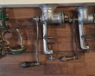 Antique kitchen tools, grinders, apple peeler, pasta cutter