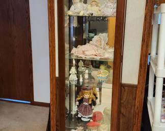 Lighted, mirrored curio cabinet, doll collection