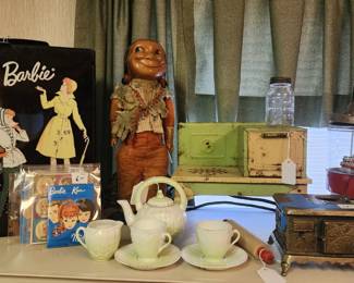 Some of the toy: Star cast iron oven, tin 1930's stove, Barbie case, Barbie catalogs, early tea set,
