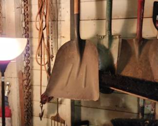 Fishing spear, chains, shovels, flag