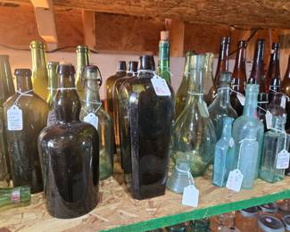 Extensive collection of antique bottles.