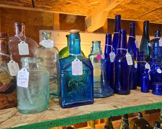 Extensive collection of antique bottles.