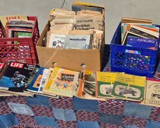 Sooooo many books! Many, many hardbacks. paperbacks, how-to manuals, old newspapers, magazines, and more books!