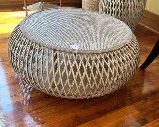 M47 - $125 - 2 Available. Distressed white rattan coffee table with wood reinforcement. 32" round 12" tall.
