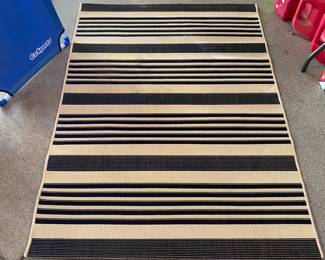 M99 - $30. Safavieh Indoor/Outdoor Rug. Measures 4' x 5'7".