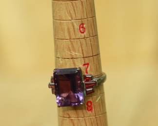 J26 - $40. Size 7. Sterling Band with Purple Stones.