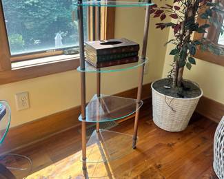 M48 - $40. Glass corner shelf. Measures 18" wide x 13" deep x 42" tall.