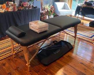 M125 - $100. Sierra Comfort Portable Massage Table with a set of new in package sheets. Includes carry case - looks brand new!
