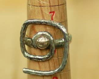 J27 - $75. Size 7. Sterling Band with 14kt gold center ball.