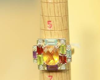 J10 - $350. Size 6. Stamped CID 10kt Thailand. Weighs 7 grams.