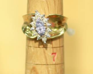 J17 - $475. Size 5.5/6. 14 kt gold. Weighs 7.4 grams. I believe the stone is Tanzanite.