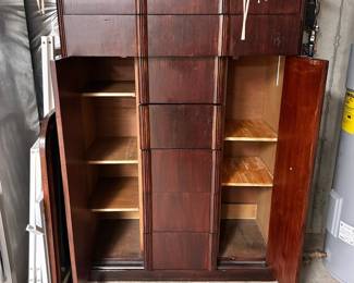 M82 - $150. 2 doors on the sides open. 5 drawers in the middle. 2 long drawers on the top.