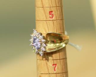 J17 - $475. Size 5.5/6. 14 kt gold. Weighs 7.4 grams. I believe the stone is Tanzanite.