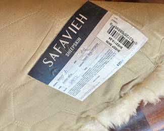 M74 - $60. Safavieh Sheep Skin White. Measures 2' x 4'.