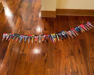 M100 - $30 - Long Display of Small Pennants.