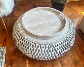 M47 - $125 - 2 Available. Distressed white rattan coffee table with wood reinforcement. 32" round 12" tall.