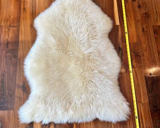 M69 - $40. Safavieh Sheep Skin White. Measures 2' x 3'.
