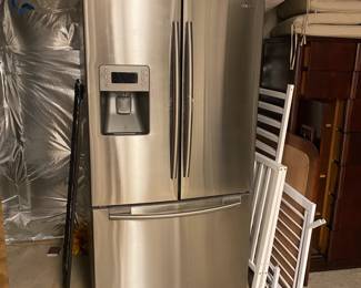 M132 - $100. Stainless Refrigerator. Samsung RF267 Series. 2010. Measures 36" wide x 32" deep x 70" tall. OWNER HAS UNPLUGGED AND DEFROSTED - I saw it running with my eyes. BUT he warns it is VERY cold and doesn't regulate the temperature quite right. Lettuce always freezes is his example. YOU NEED 2 STRONG PEOPLE TO MOVE! It is located in a walkout basement and will need to go around the home.