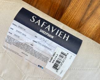 M69 - $40. Safavieh Sheep Skin White. Measures 2' x 3'.