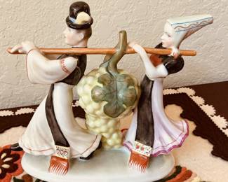 Hungarian Herend Matyo Folk figures carrying grapes for the wine press.