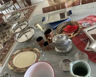 Fantastic number of handpainted ceramic pictures, serving plates and silverplate serving vessels from different countries and periods.